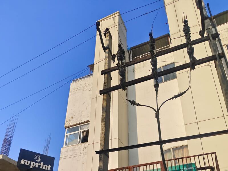 The incoming service and pole mounted equipment at a completed building